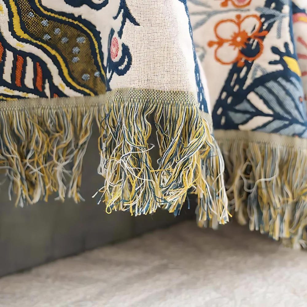 Decorative cotton throw with woven floral pattern and fringes