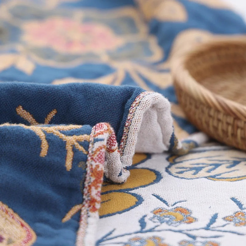 Decorative cotton throw with woven floral pattern and fringes