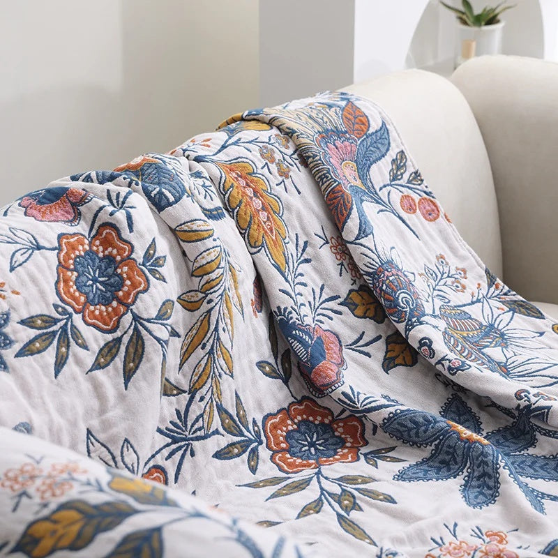 Decorative cotton throw with woven floral pattern and fringes